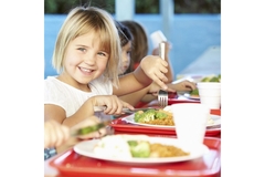 Image A group of children eating lunch in a school cafeteria.
